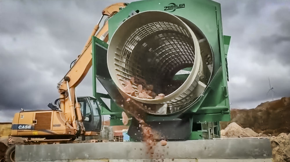 Sand plant material being processed
